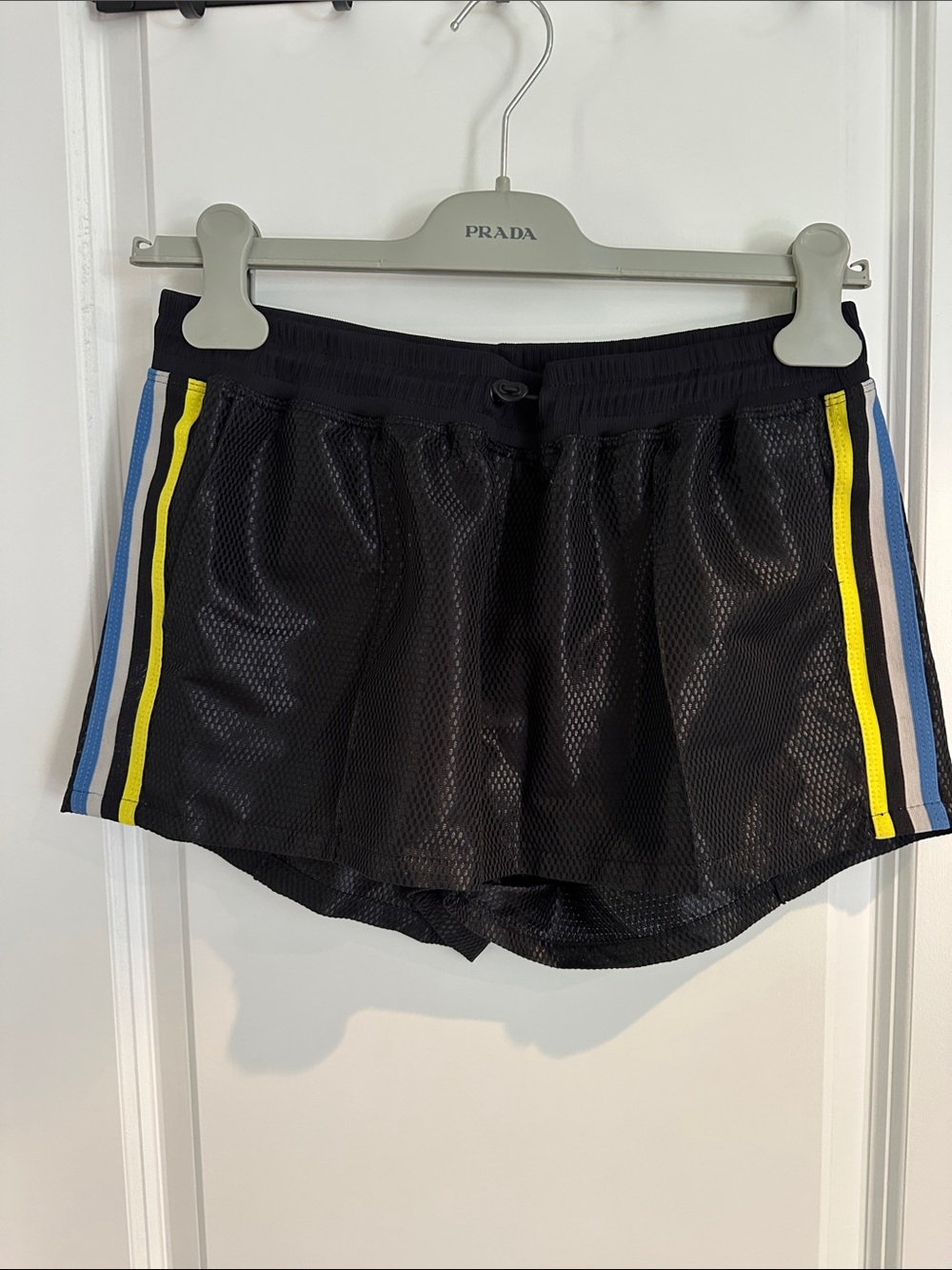Koral Black Athletic Shorts with Blue and Yellow Side Stripes. Pockets.